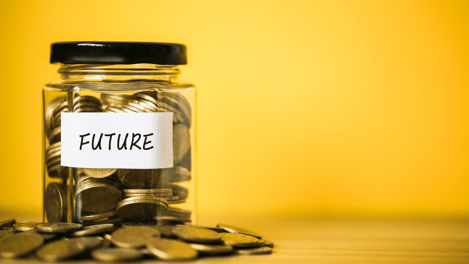 Savings jar filled with coins, labeled "FUTURE" on a yellow background.