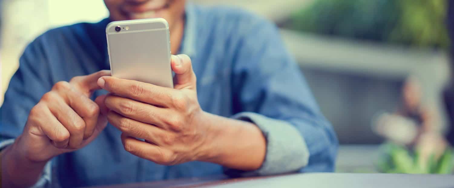 man looking at his cell phone