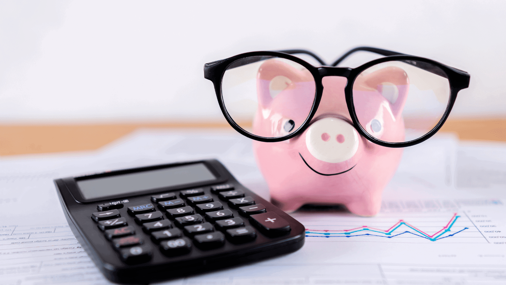 A piggybank and calculator