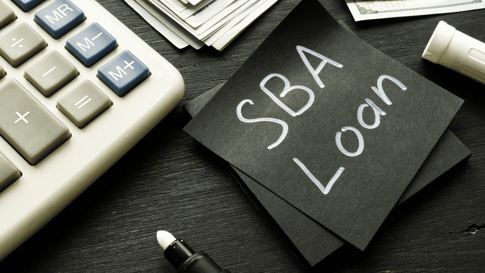 A napkin that has SBA Loan written on it
