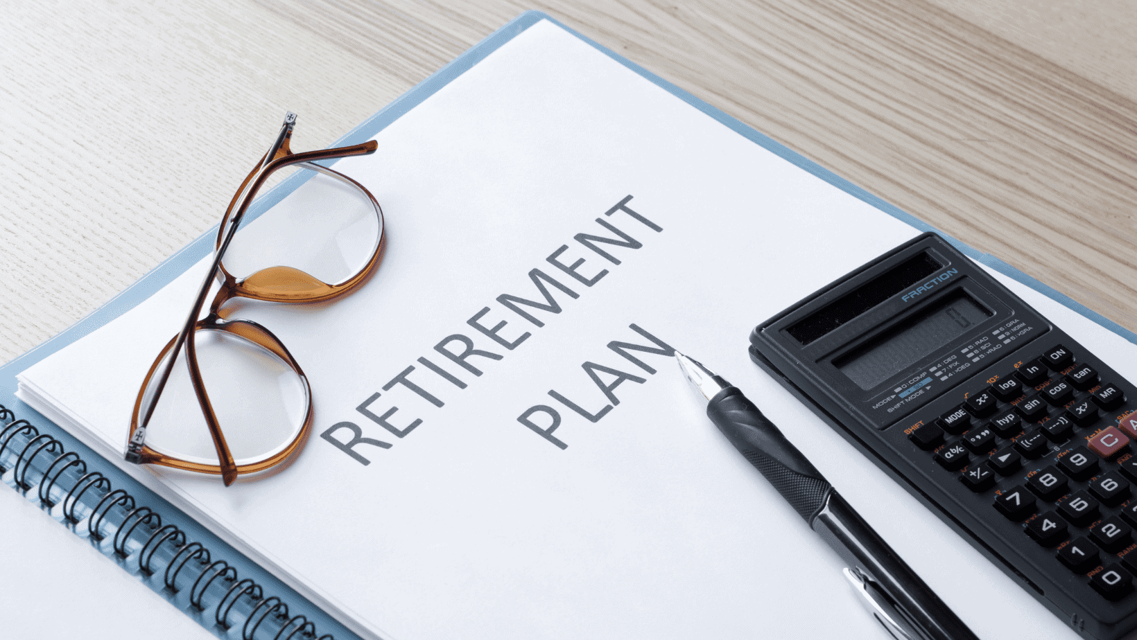 A notebook with Retirement Plan on the front