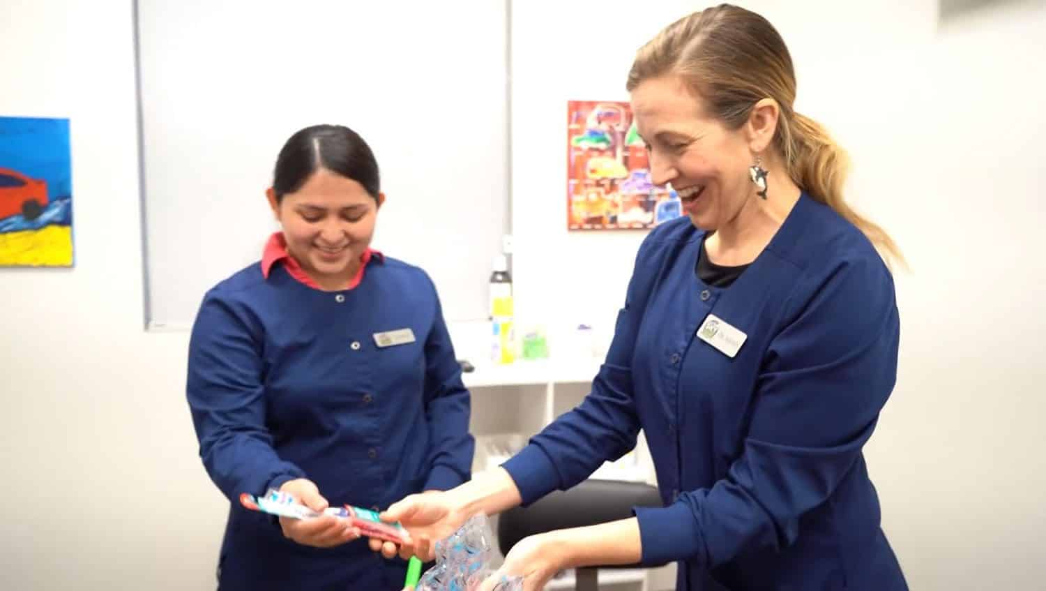 Dr. Amanda Ashley preps for a patient with an assistant
