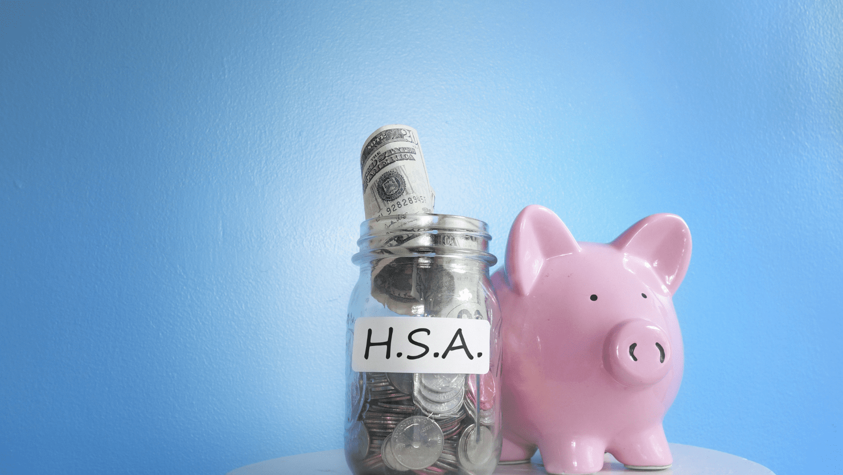 Piggy bank and jar with hsa label.