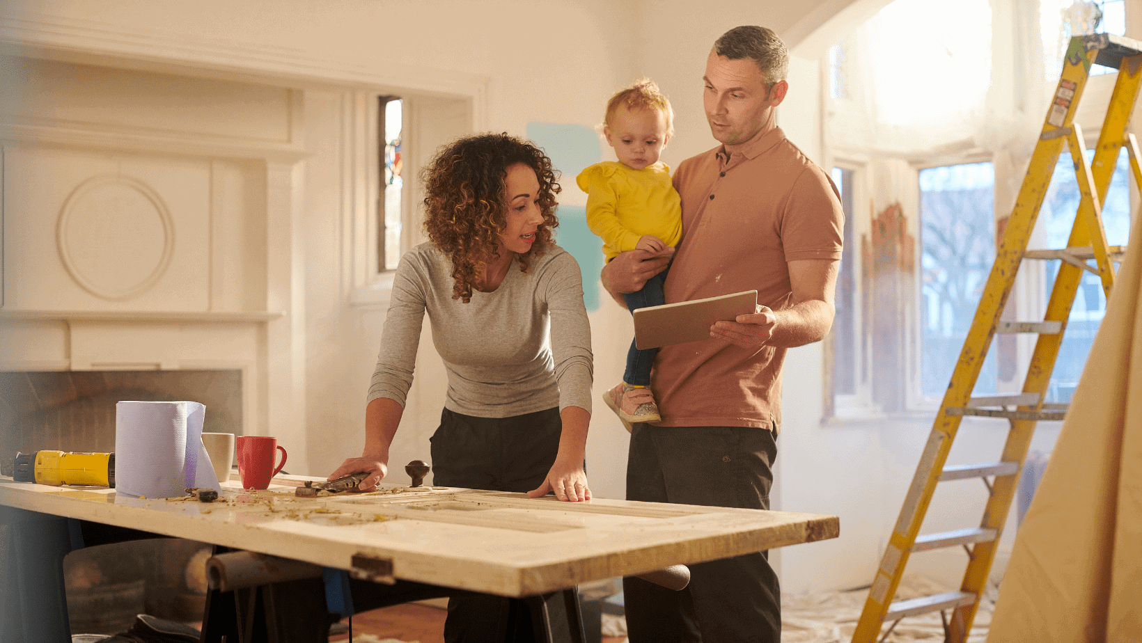Family discussing renovation plans with a child at home.