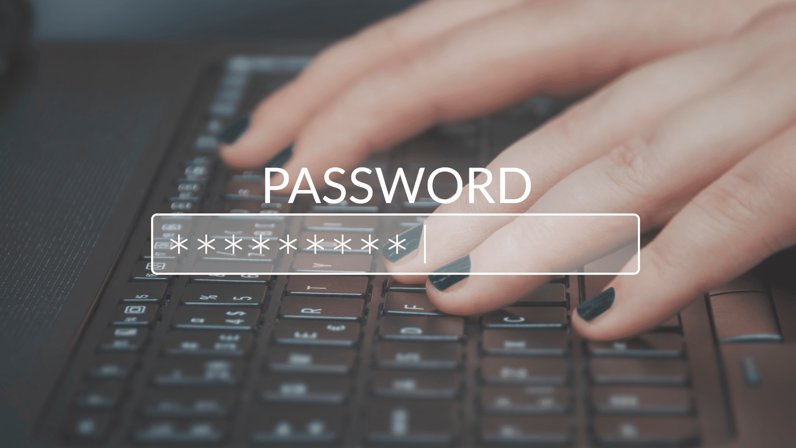 Person typing a password on a laptop keyboard with a password field.