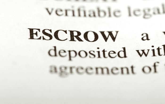 Close-up of the word "ESCROW" in a legal document.